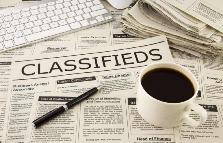 Job Search Workspace with Classifieds, Coffee, Pen, Keyboard - Morning Job Hunt Scene