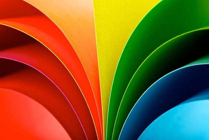 Colorful rainbow spectrum fan art with glossy finish and vibrant colors.