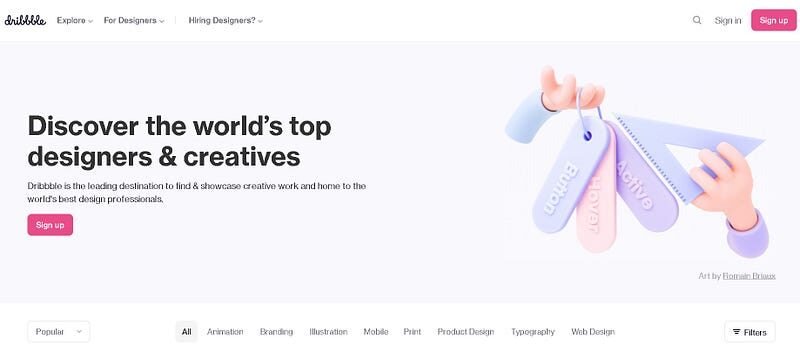 A website landing page for Dribbble featuring a headline "Discover the world's top designers & creatives", with a call-to-action button "Sign up". A graphic illustration on the right shows a hand holding a set of swatches with the words "design", "color", and "create". Navigation options and categories such as Popular, All, Animation, Branding, and more are provided below.