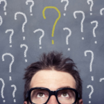 Curious person surrounded by question marks on textured grey background.