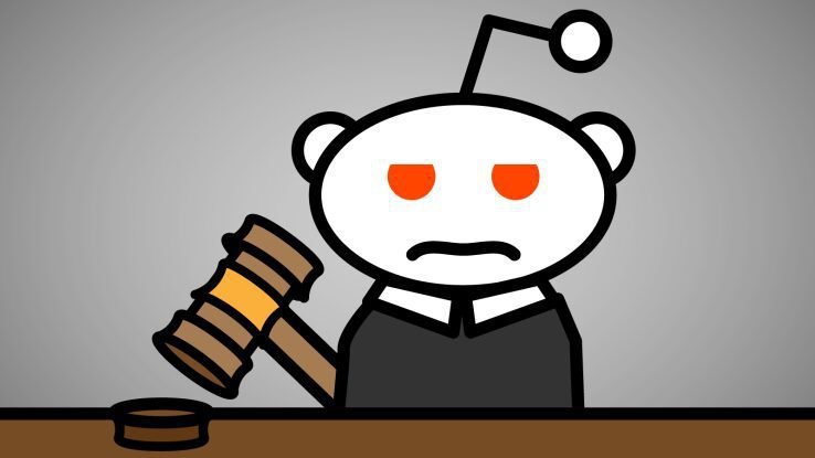 Snoo as judge with gavel at desk, featuring orangered eyes and serious expression.