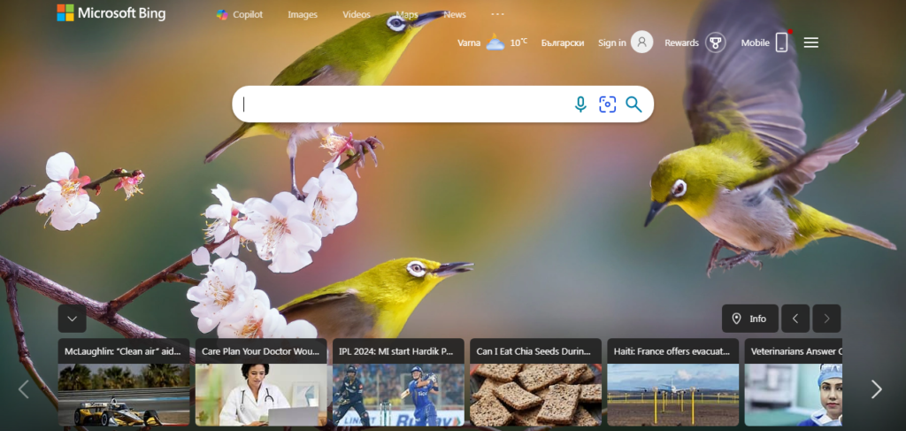 Alt text: Microsoft Bing search engine homepage displaying a thematic background with three Japanese White-eye birds among cherry blossoms, with the central bird in mid-flight and a blurred background, alongside interface elements like search bar, buttons, and weather widget.