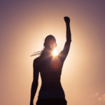 Triumphant silhouette against vibrant sunset sky, symbolizing success and inspiration.