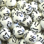 Close-Up of White Lottery Balls - Numbers in Bold Black for Luck & Chance