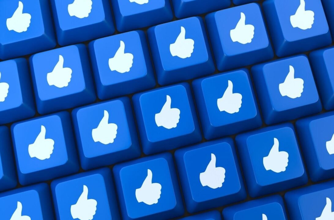 Approval-themed keyboard keys with white thumbs-up icons on a blue background.