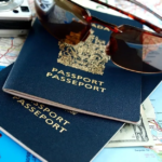 Essential travel items: passports, map, sunglasses, camera.