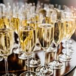 Elegant champagne flutes ready for celebration at festive event.