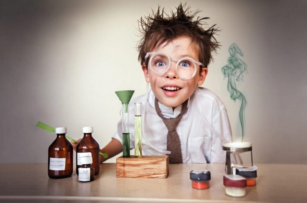 Child conducting vibrant science experiment with chemicals and test tubes on table.