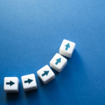 Decision-making journey: white tiles with diagonal arrows on blue background.