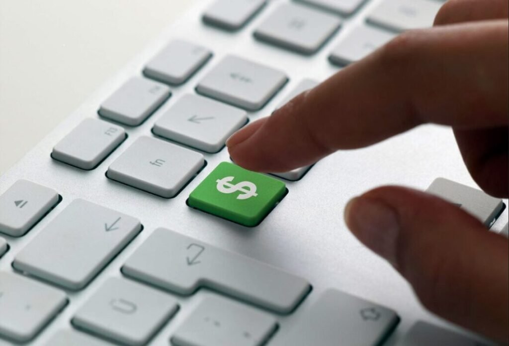 Modern keyboard with green $ key pressed, symbolizing financial transactions and commands.