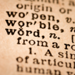 Definition and origin of word in vintage dictionary page, highlighting vocabulary depth.