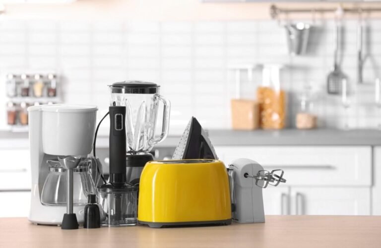 Modern kitchen countertop with coffee maker, blender, and yellow toaster in a contemporary setting.