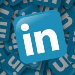 3D rendering of scattered LinkedIn logos with central logo in focus.