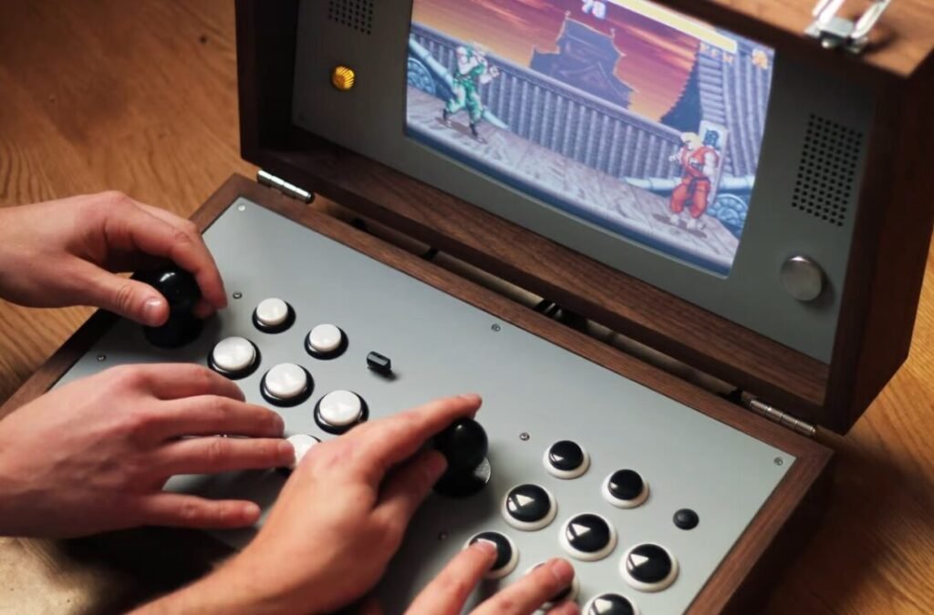 A person playing a classic arcade game on a custom-built portable arcade cabinet with joystick and buttons.