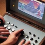 Custom arcade console with joystick, buttons, and retro fighting game on screen.