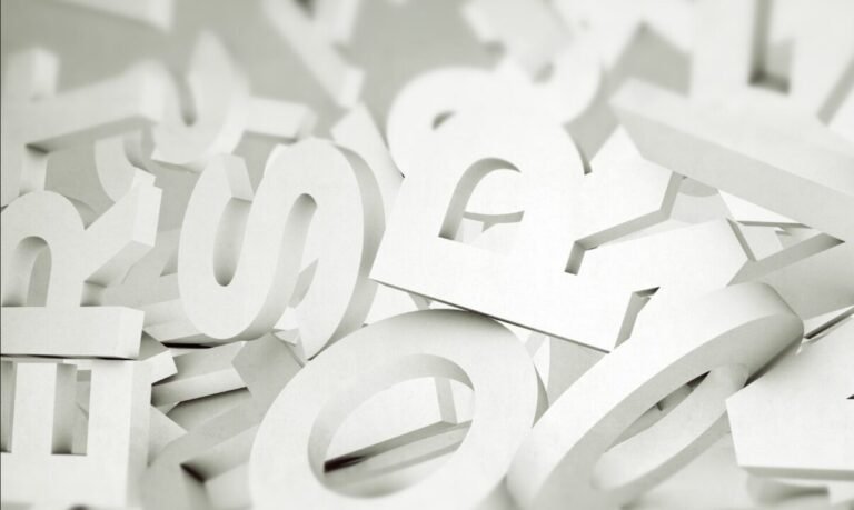 Scattered white letters in various fonts creating a chaotic composition with shadows.