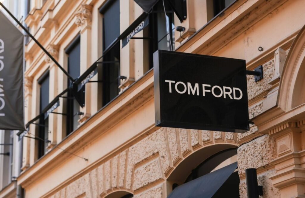 Tom Ford brand sign hanging on the facade of a classical architecture building.