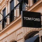 Tom Ford brand sign on elegant classical building facade.