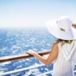 Tranquil ocean view from luxury cruise ship deck on sunny day.
