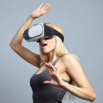 Blonde woman immersed in VR experience, reacting with surprise and concentration.