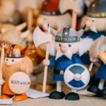 Hand-painted Viking figurines from Estonia with helmets, shields, and weapons in a collection.