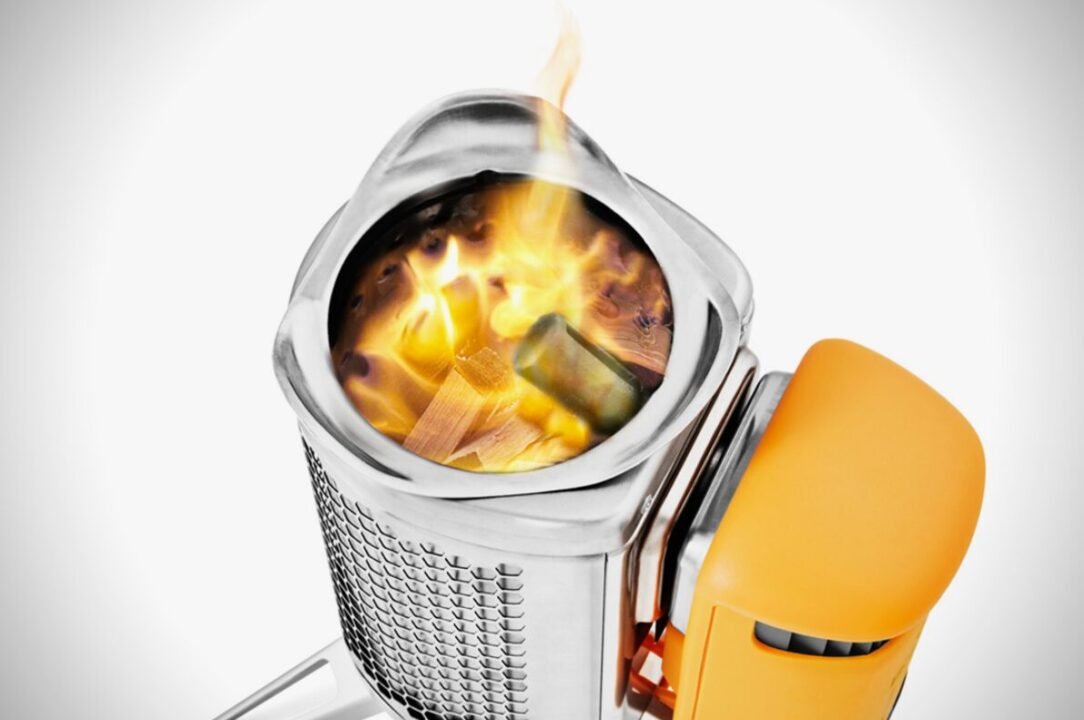 Astronaut helmet with a reflective visor showing a fire burning inside, set against a white background.