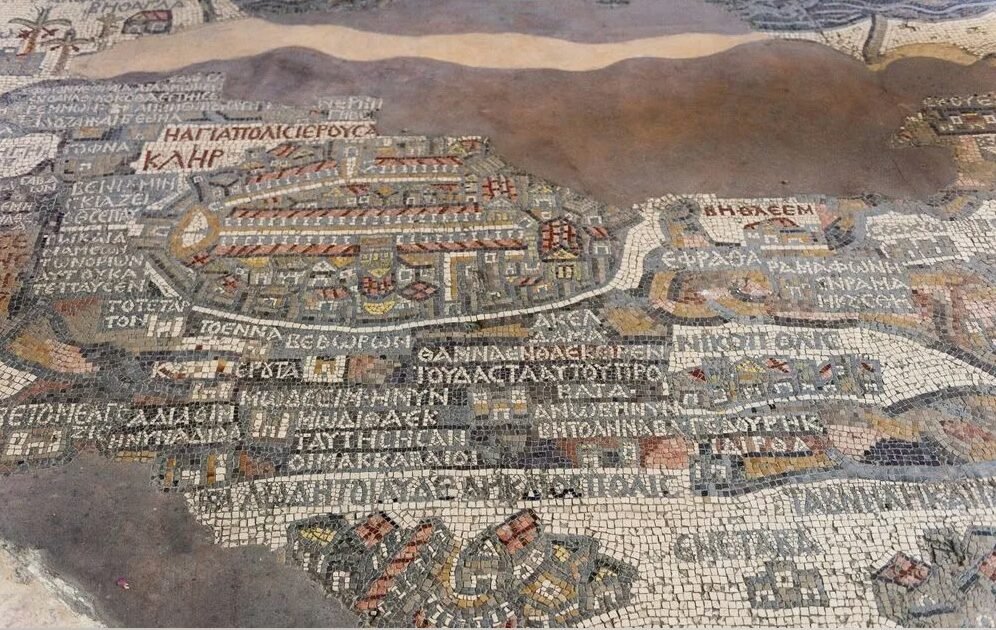 Ancient mosaic map with Greek inscriptions and depictions of buildings and roads.