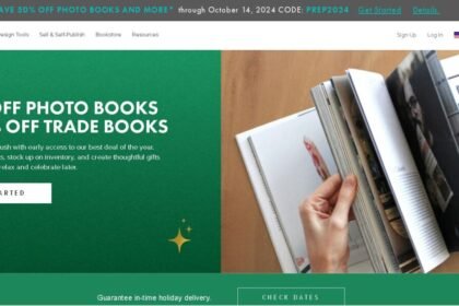 Website offering 50% off photo books and 25% off trade books, featuring a person flipping through a book.