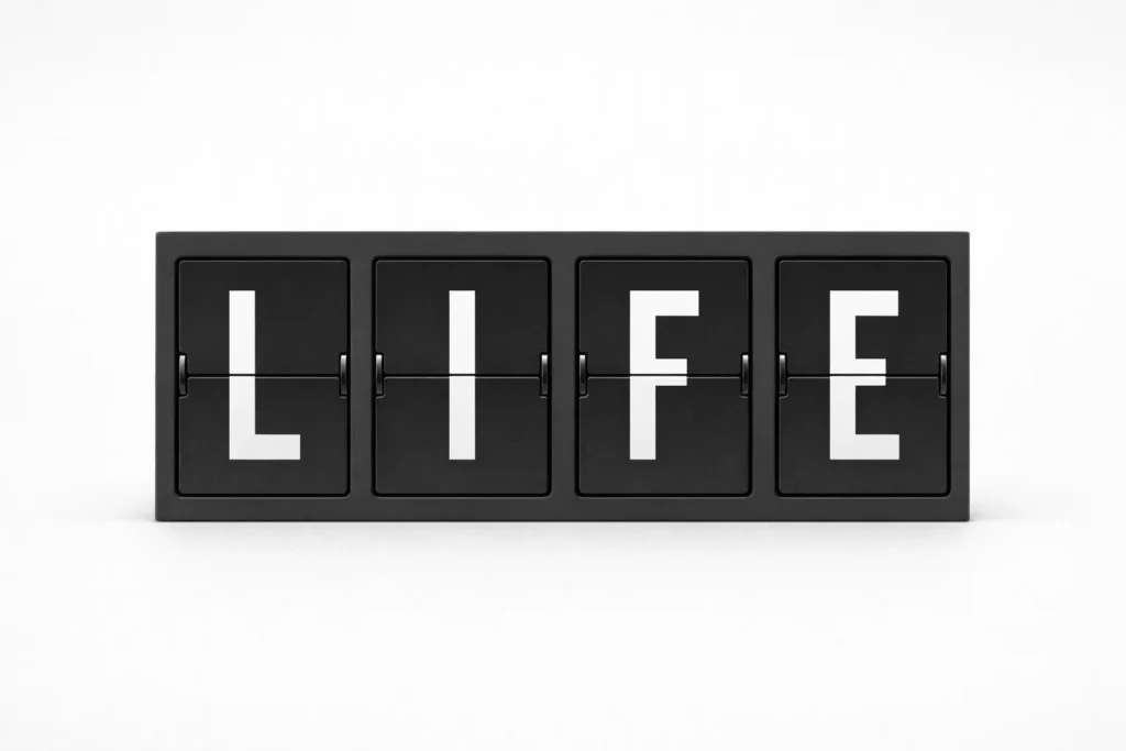 The word "LIFE" on a mechanical split-flap display