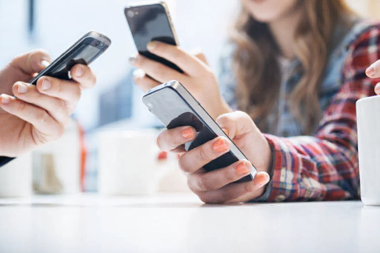 young people using their phones- social media concept